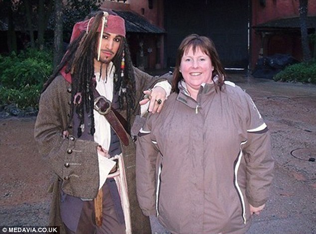 1408615168554_wps_3_Kathy_at_Disneyland_Kathy