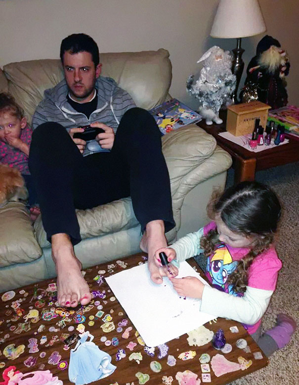 Letting His Daughter Do His Nails While Playing A Video Game
