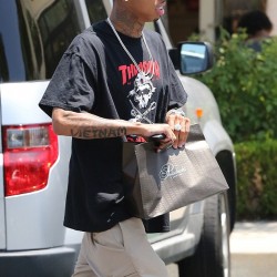 360E6EF400000578-3680190-Thoughtful_Earlier_in_the_day_Tyga_was_spotted_at_a_high_end_jew-a-11_1467963757960