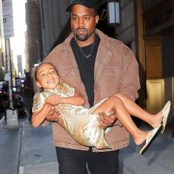 Kanye West Carries North As Leaving The Polo Bar In New York